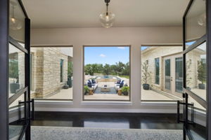 Grand entrance with immediate views of the pool.