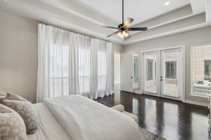 Primary bedroom suite with coffered ceilings, with a private entrance to the pool.