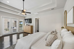 Primary bedroom suite overlooking the pool.
