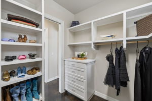 One of two primary walk-in closets for him and her.