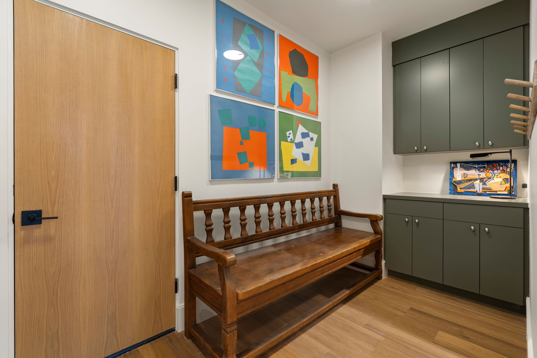 Generous mud room/drop zone is your first stop from the garage