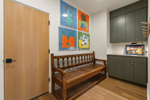 Generous mud room/drop zone is your first stop from the garage