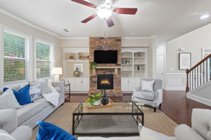 Spacious Living Space with Stacked Stone Fireplace