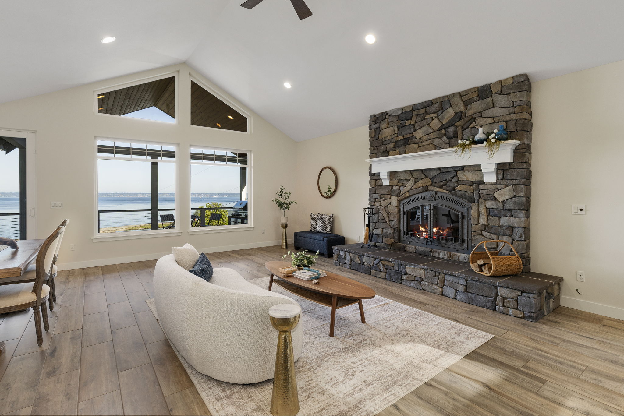 Vaulted ceilings, stone fireplace, in floor radiant heat tile floors and endless views!