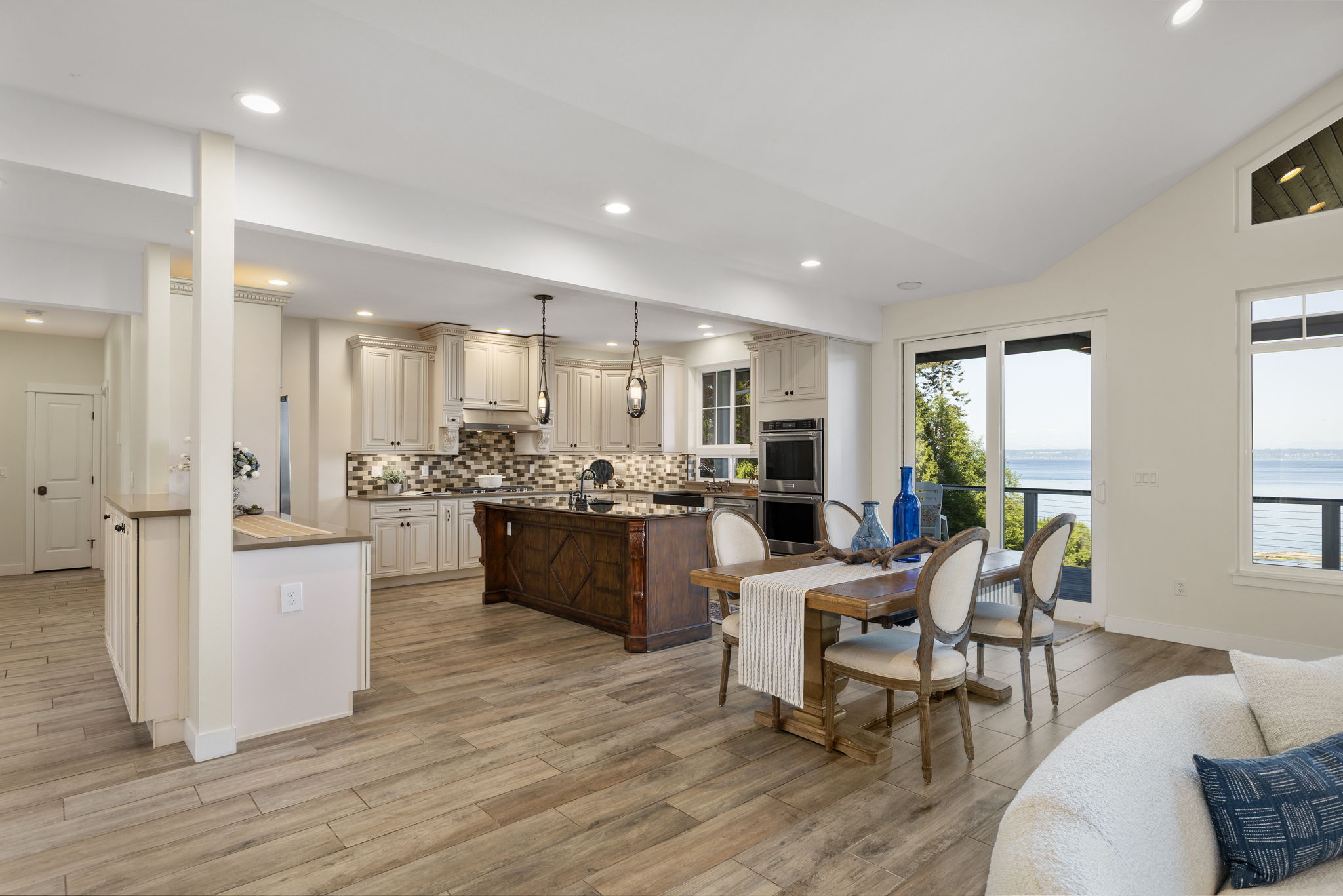Open concept, sliding door to covered deck, in floor radiant heated tile flooring, chefs kitchen...VIEWS!