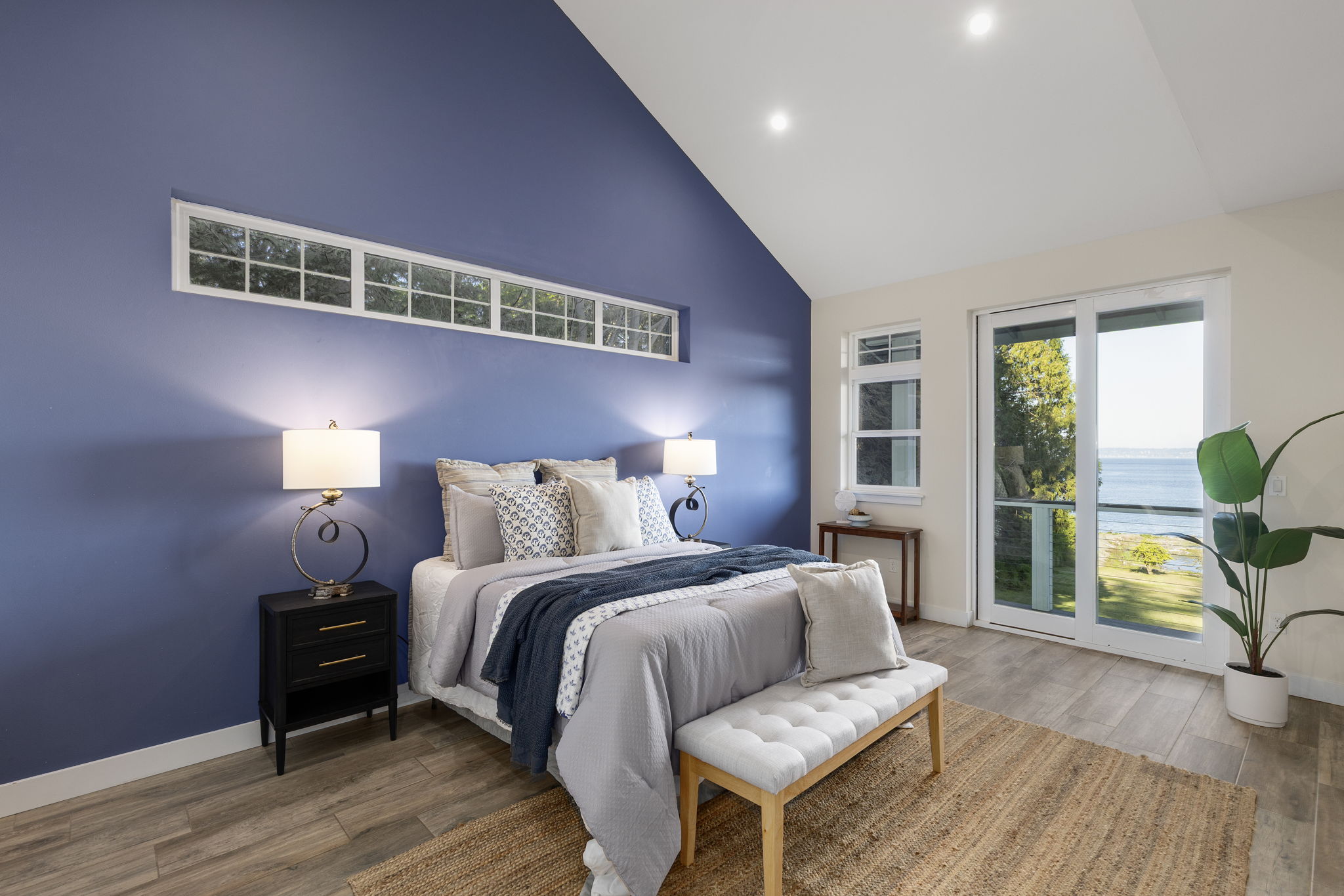 Main floor primary suite with 2 closets AND access to deck to soak up those views!
