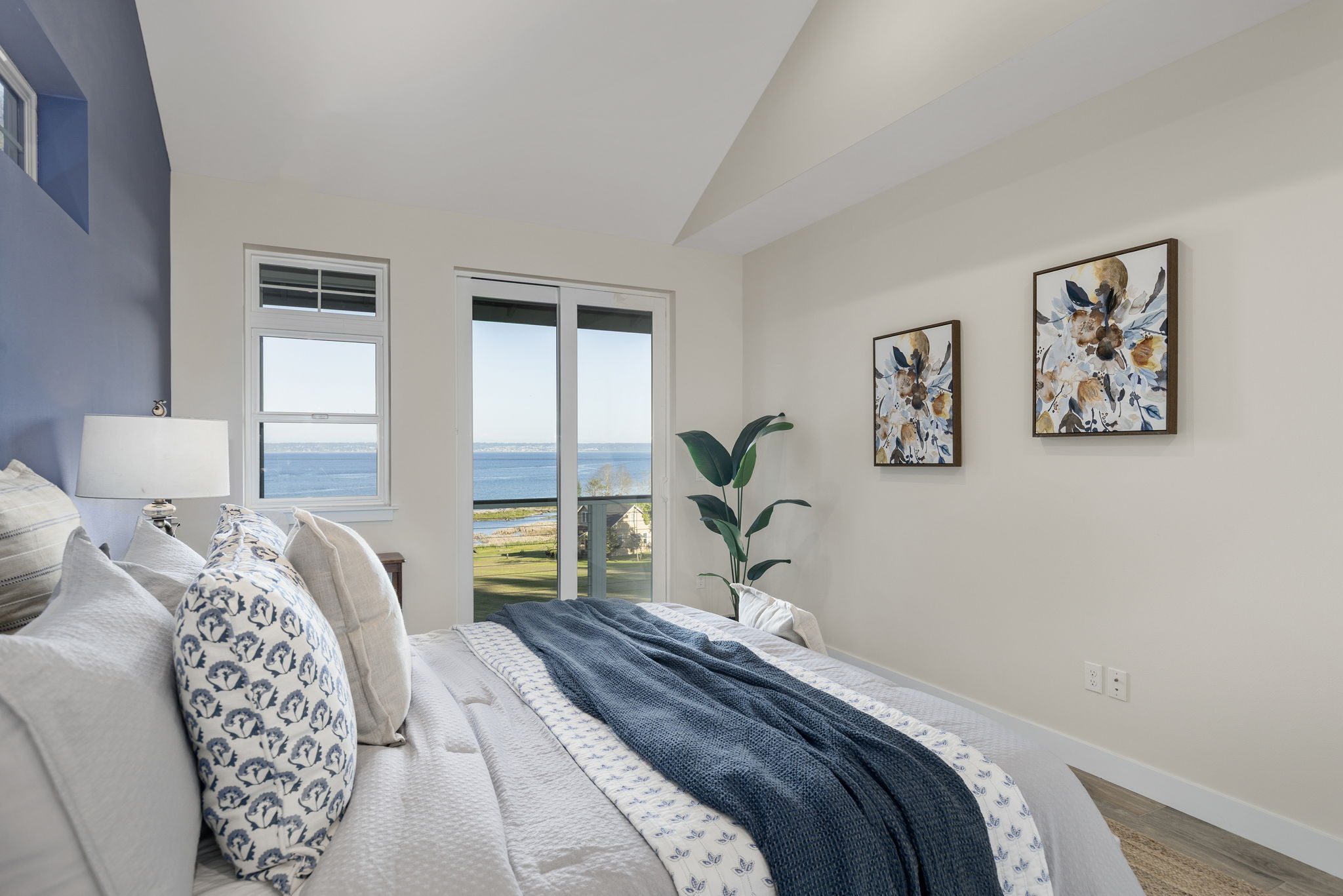 Main floor primary suite with 2 closets AND access to deck to soak up those views!