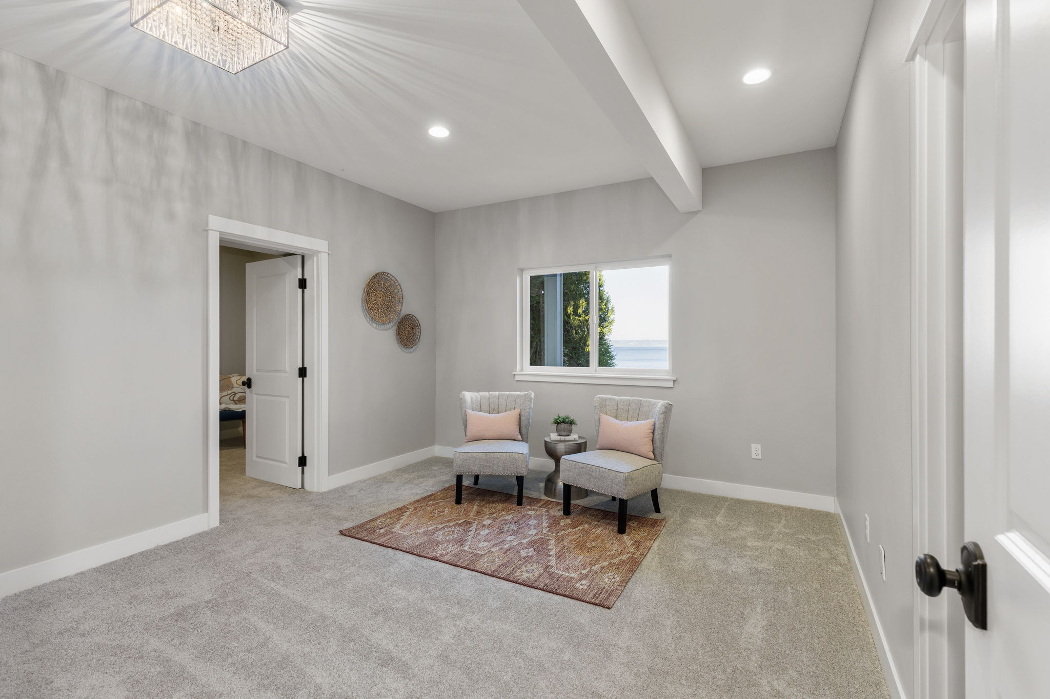 Another shot of lower level bedroom with ensuite AND water views...through the doorway on the left, a room sized closet!