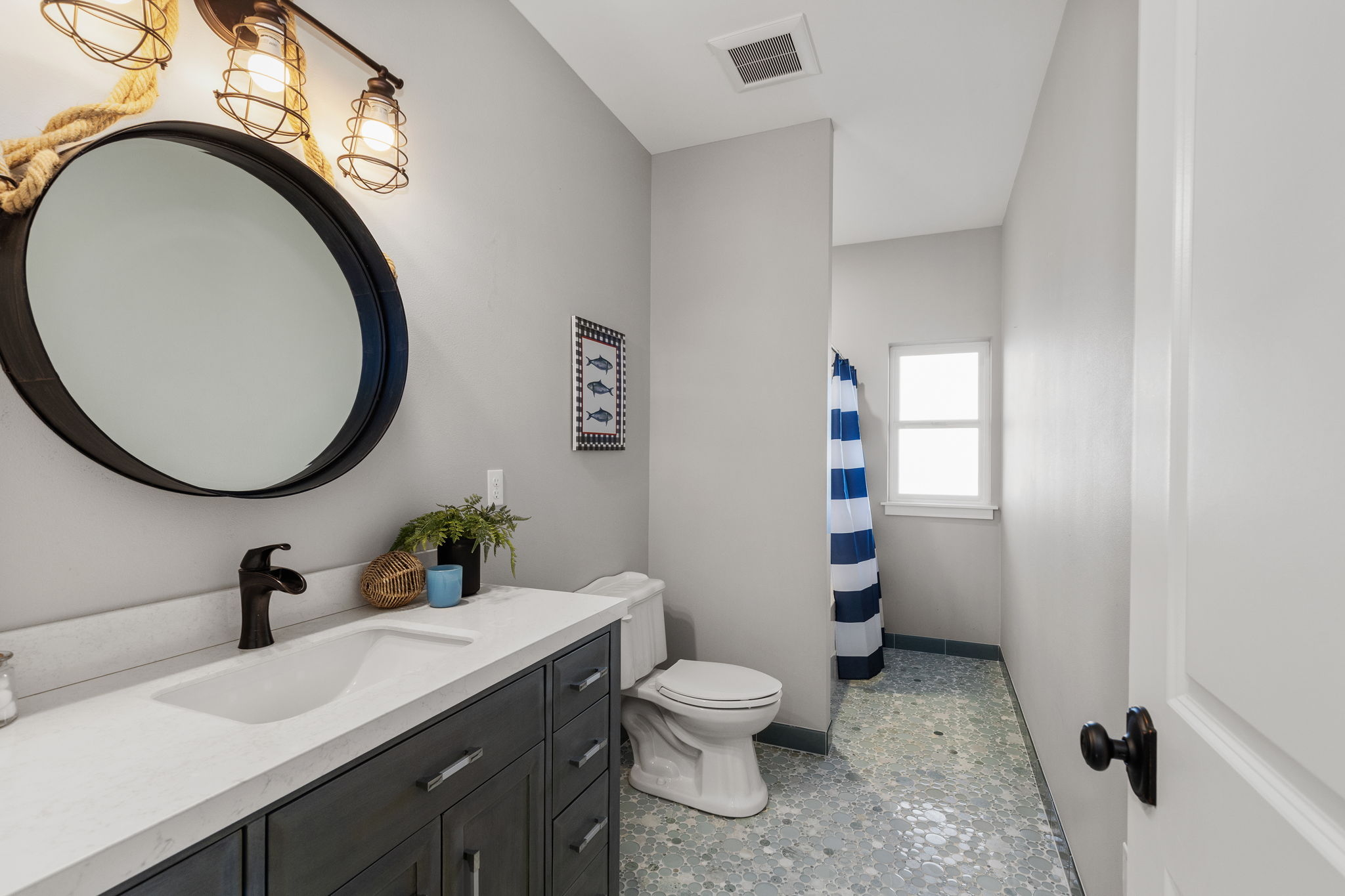 2nd lower level full bath with gorgeous custom tile floors...must see in person!