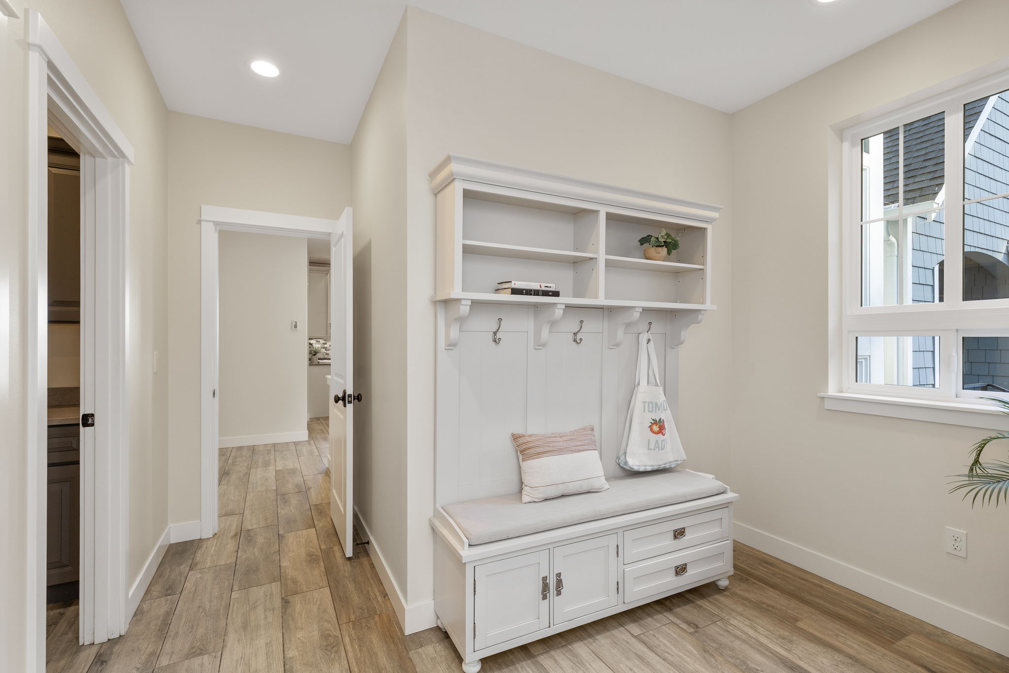 Expansive mudroom off 3 car garage...proper main floor laundry room to the left.
