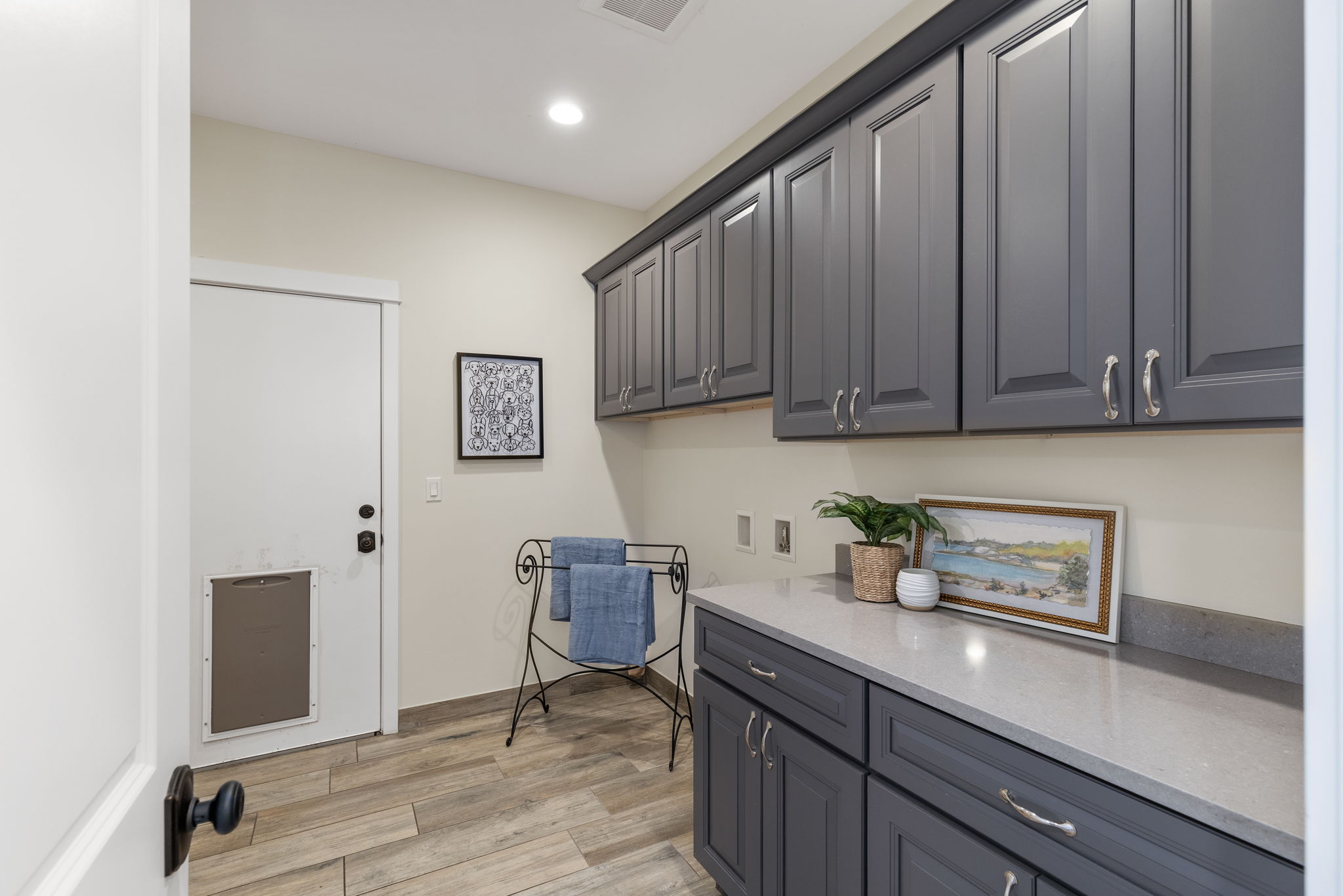 Proper laundry room. Door to Large 3 car garage.