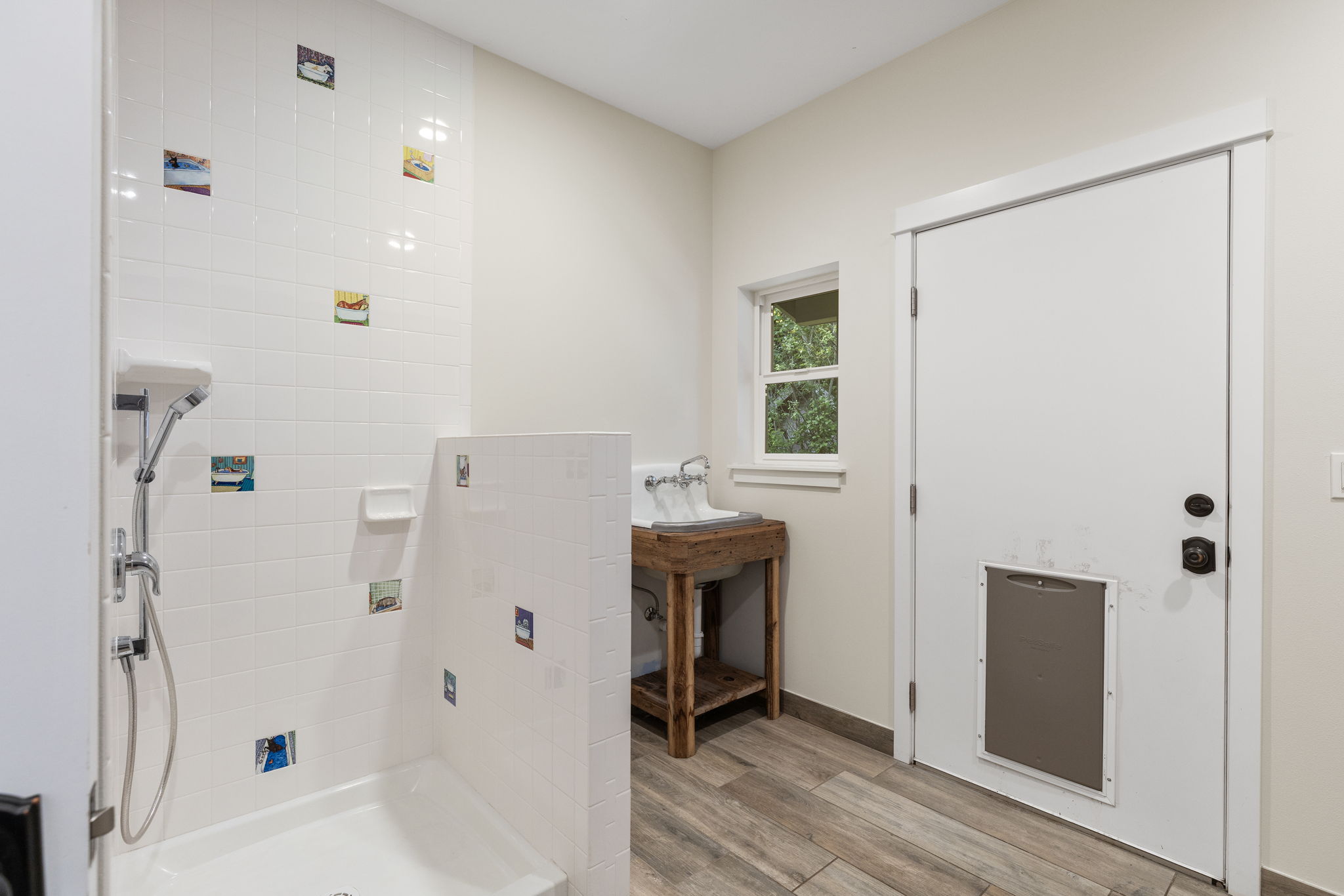 Doggy wash shower, sink and door to fenced dog run!