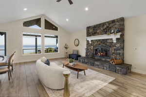 Vaulted ceilings, stone fireplace, in floor radiant heat tile floors and endless views!