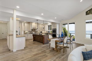 Open concept, sliding door to covered deck, in floor radiant heated tile flooring, chefs kitchen...VIEWS!