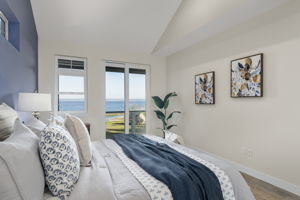 Main floor primary suite with 2 closets AND access to deck to soak up those views!