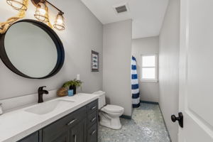 2nd lower level full bath with gorgeous custom tile floors...must see in person!