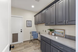 Proper laundry room. Door to Large 3 car garage.