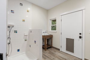 Doggy wash shower, sink and door to fenced dog run!