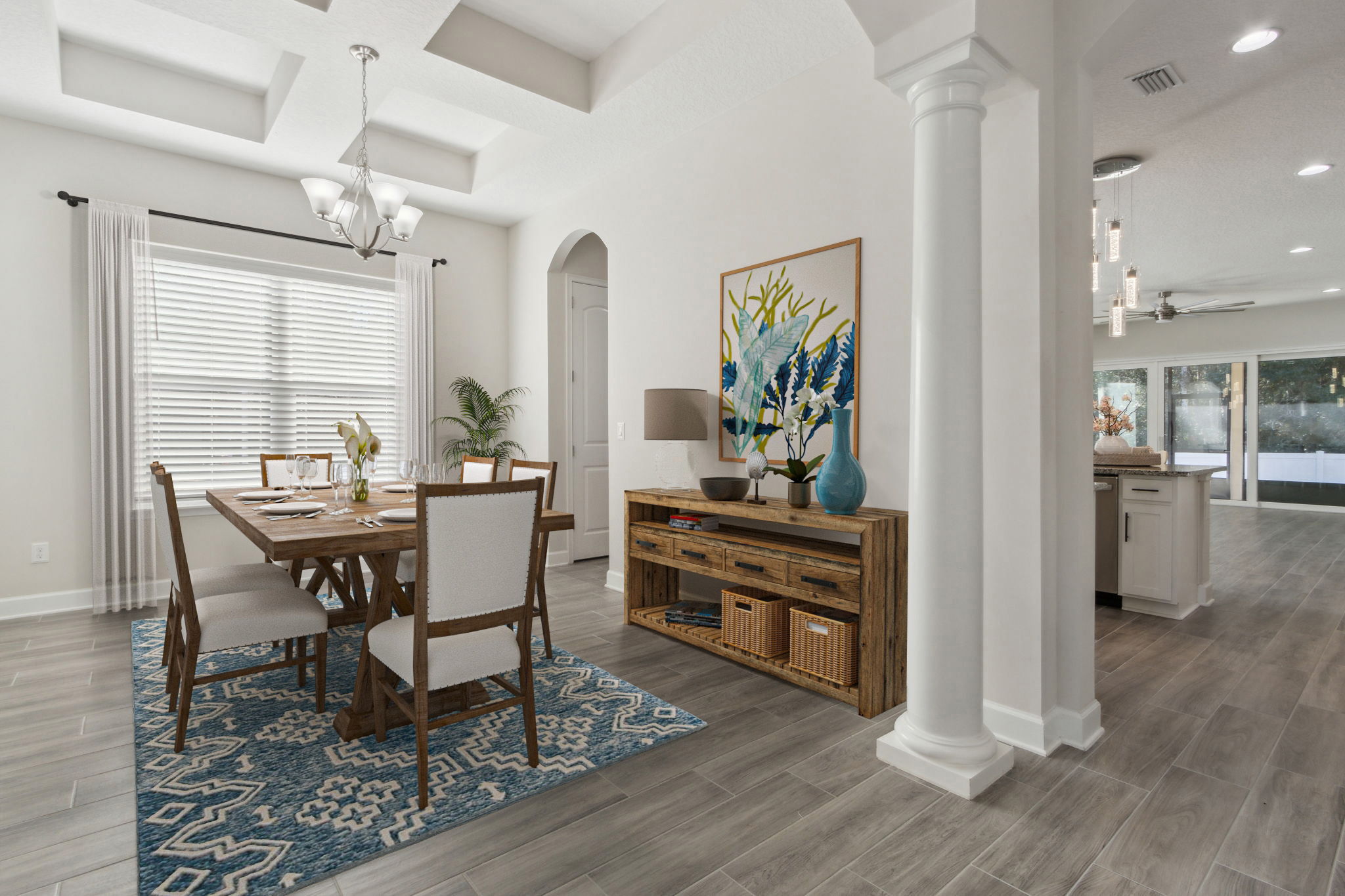 ...accented with sophisticated columns and coffered ceilings. (Staged)