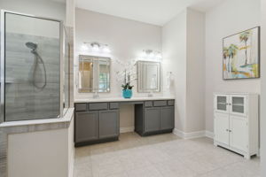 The generous master bath boasts dual vanities ...