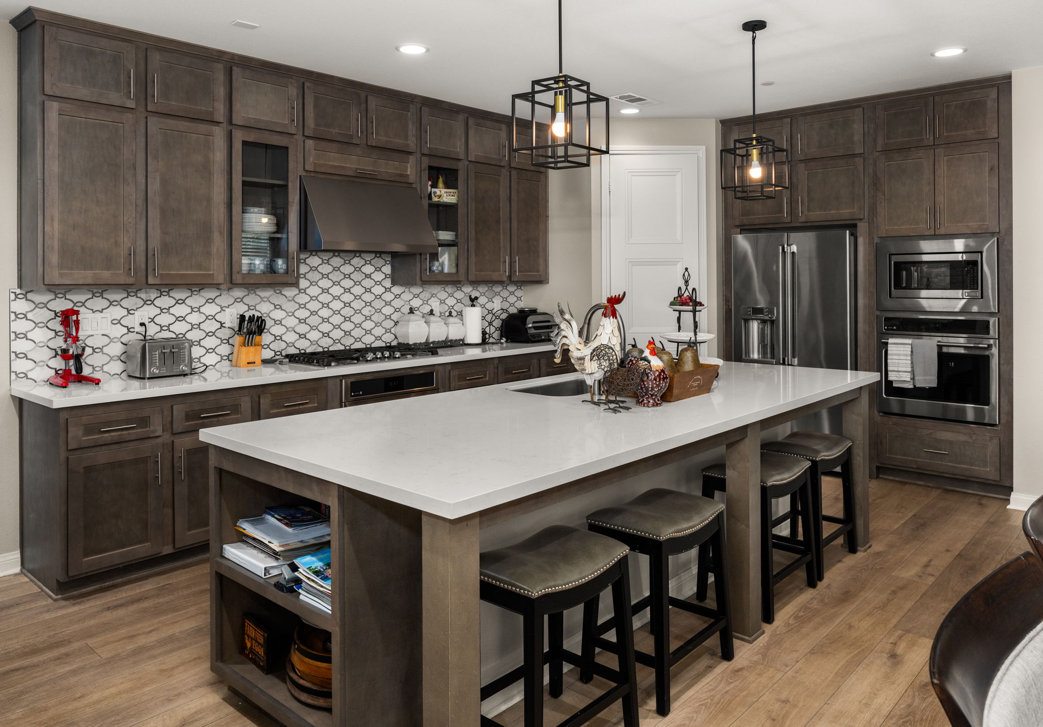 Highly upgraded chef's kitchen with designer backsplash