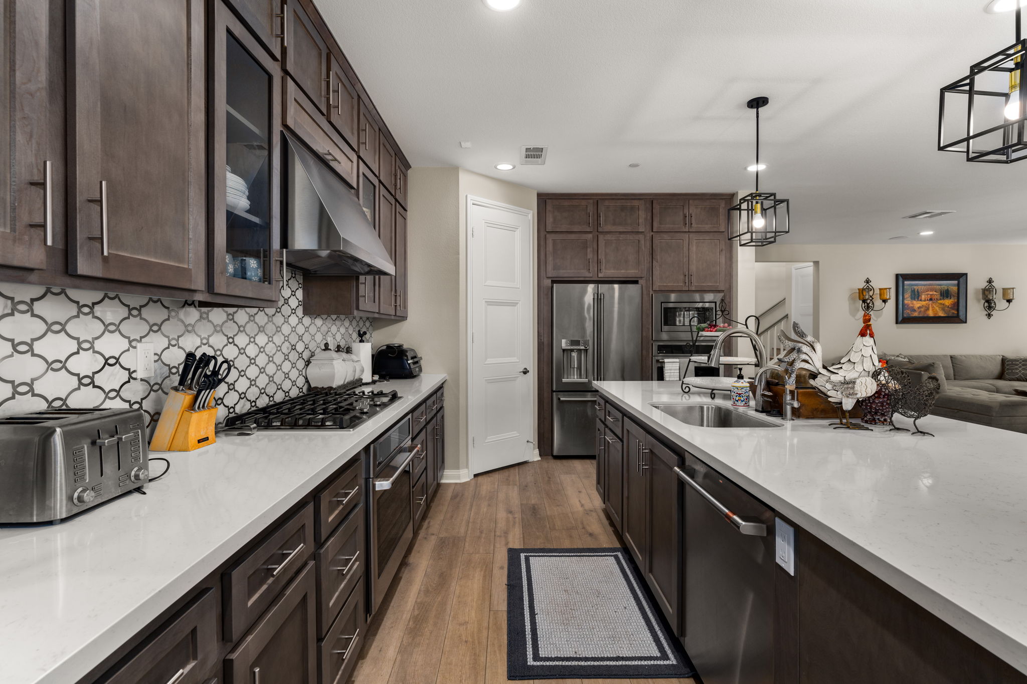 Highly upgraded chef's kitchen with designer backsplash