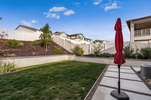 Backyard is an entertainer's dream, featuring a sparkling "spool" (spa/mini pool) with waterfall feature; built in fire pit with built in benches; built in natural gas BBQ island with sink and fridge; pavers & outdoor fans; built in outdoor surround sound speakers