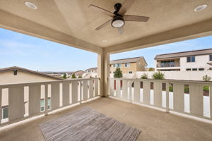 Large balcony with ceiling fan just off the upstairs living room, with views of your dream backyard