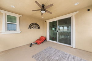 Large balcony with ceiling fan just off the upstairs living room, with views of your dream backyard