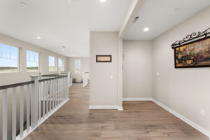 Inside features upgraded flooring, custom paint, and shutters throughout