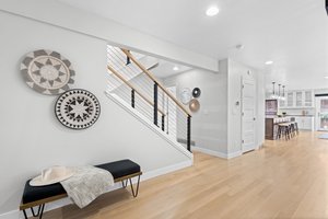 Entry featuring cable railing staircase