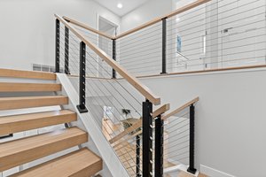 Contemporary cable railing open staircase
