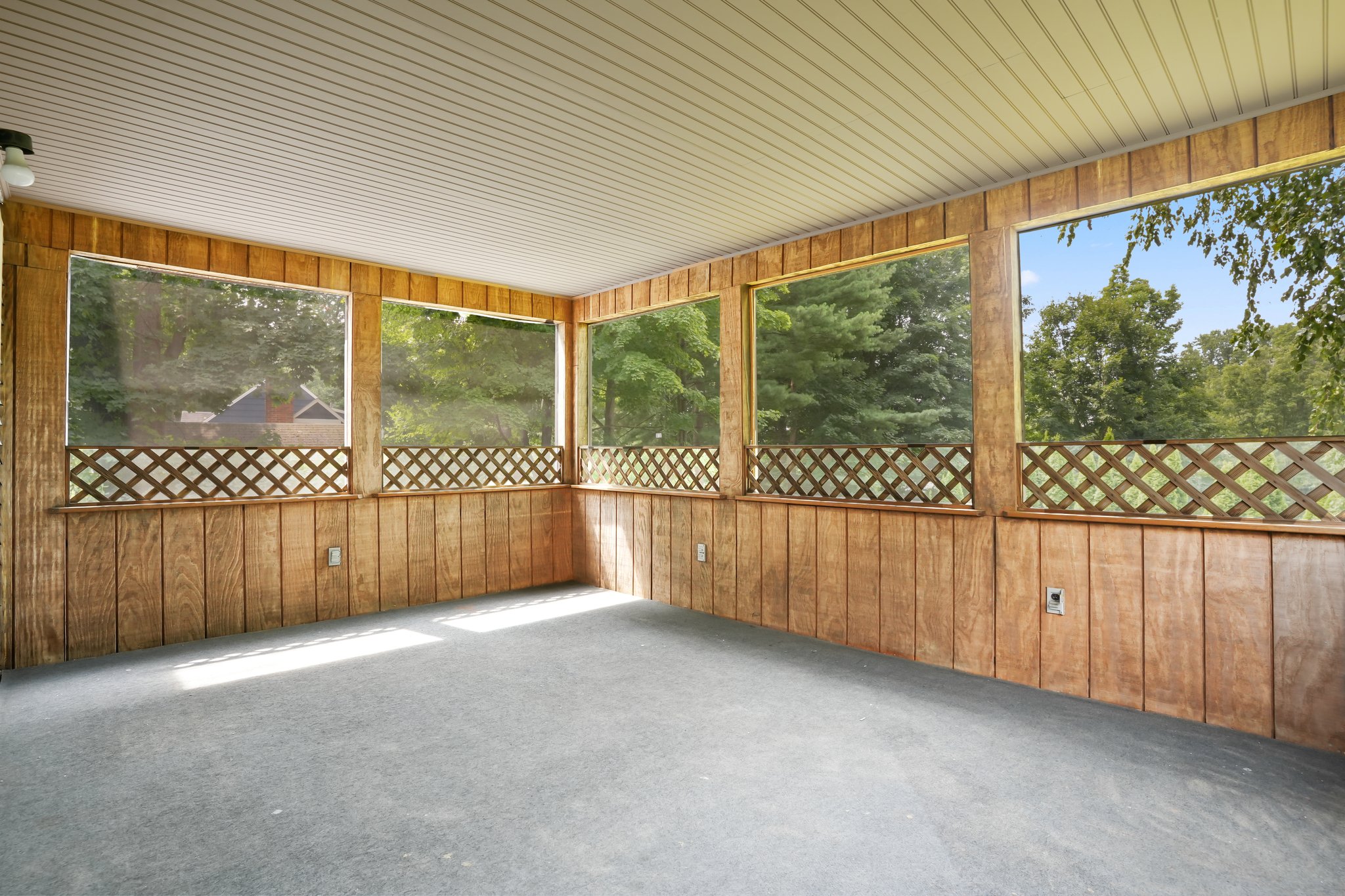 Screen porch overlooking private tree-lined back yard