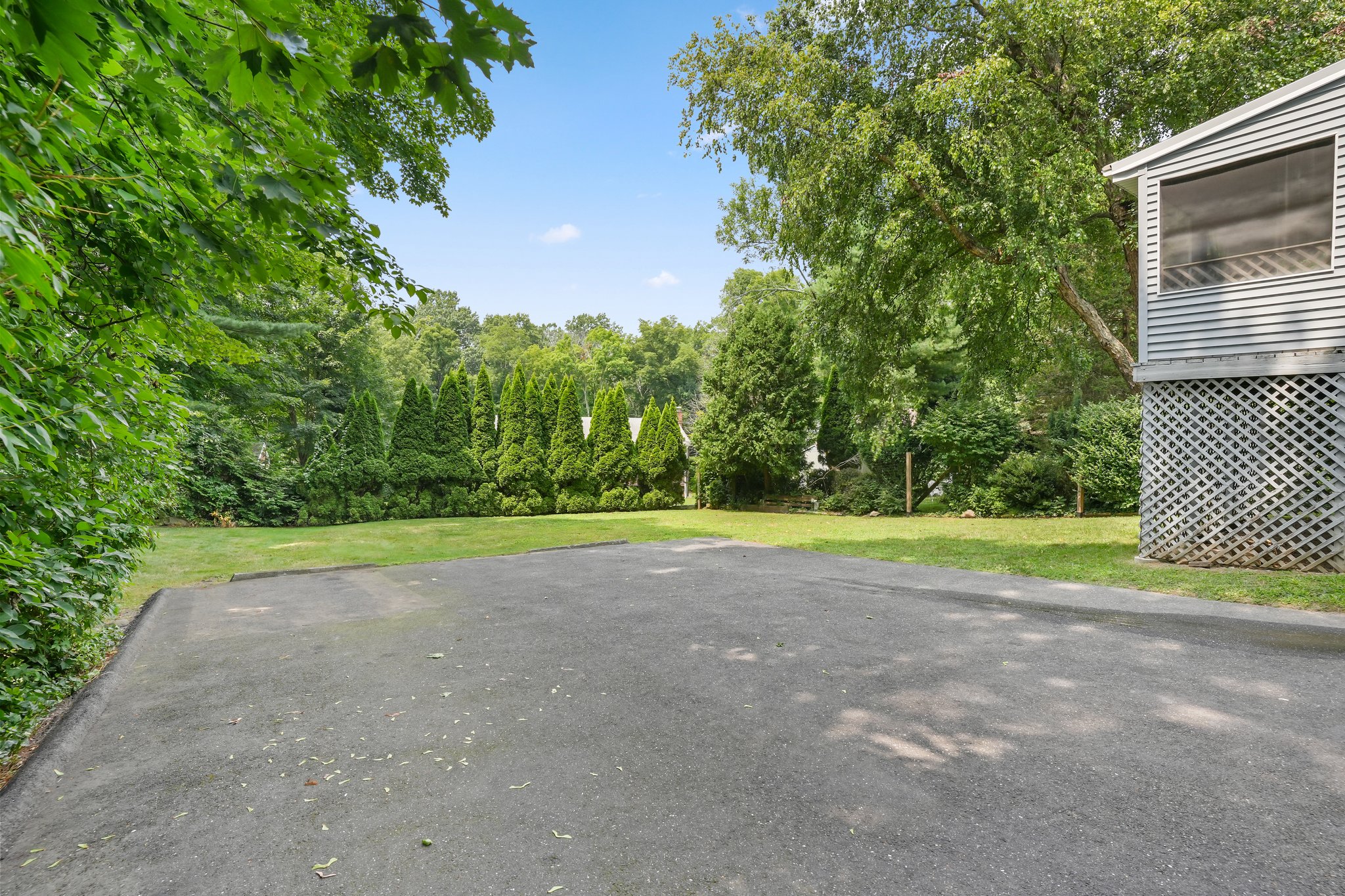 Tree lined private back yard