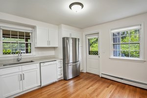 Kitchen with side entrance and screened porch