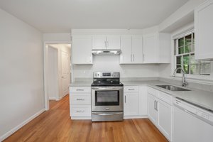 Kitchen with New cabinets and quartz countertops and HW floors