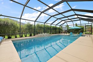 Swimming Pool with Beach Area and Water Fountain