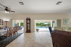 Dining and Living Rooms with Sliding Glass Doors to Pool and Lanai