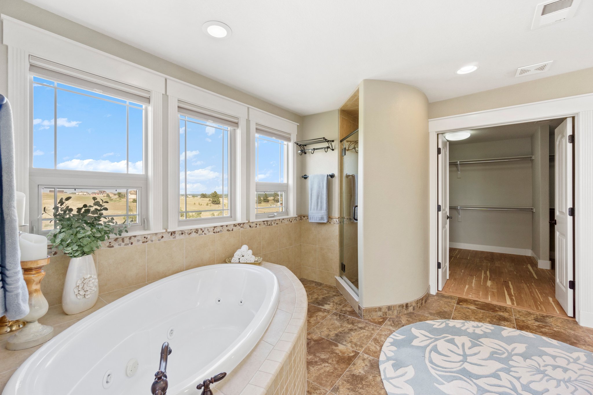 Standing glass shower~ Large soaking tub~ Huge walk-in closet with bamboo flooring