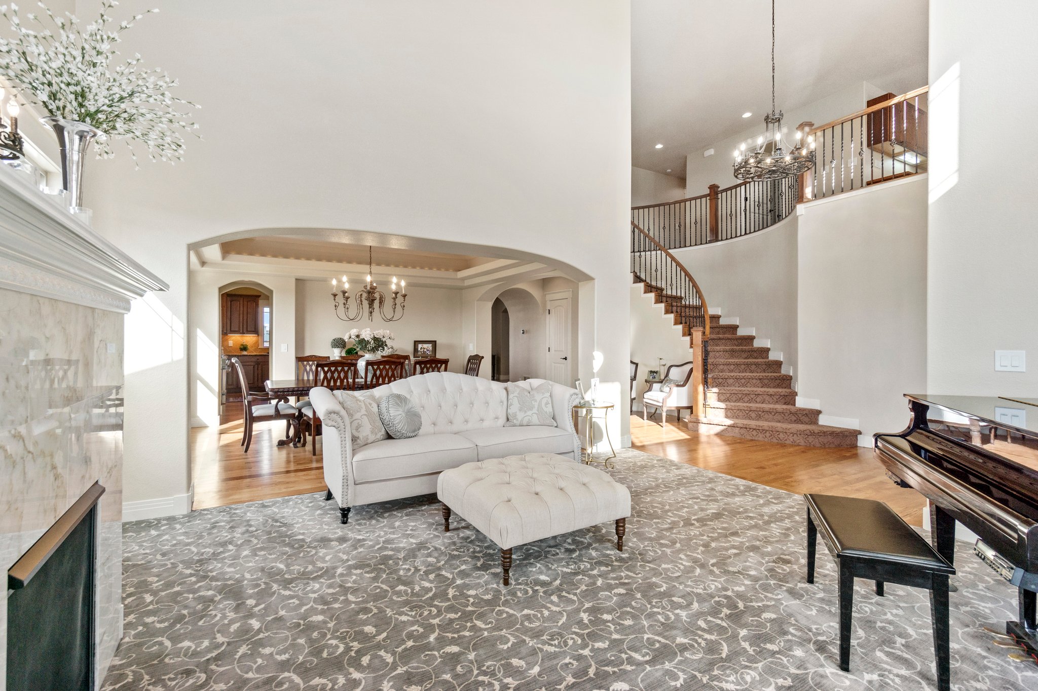 Vaulted ceilings with large windows flood your entrance with beautiful natural light