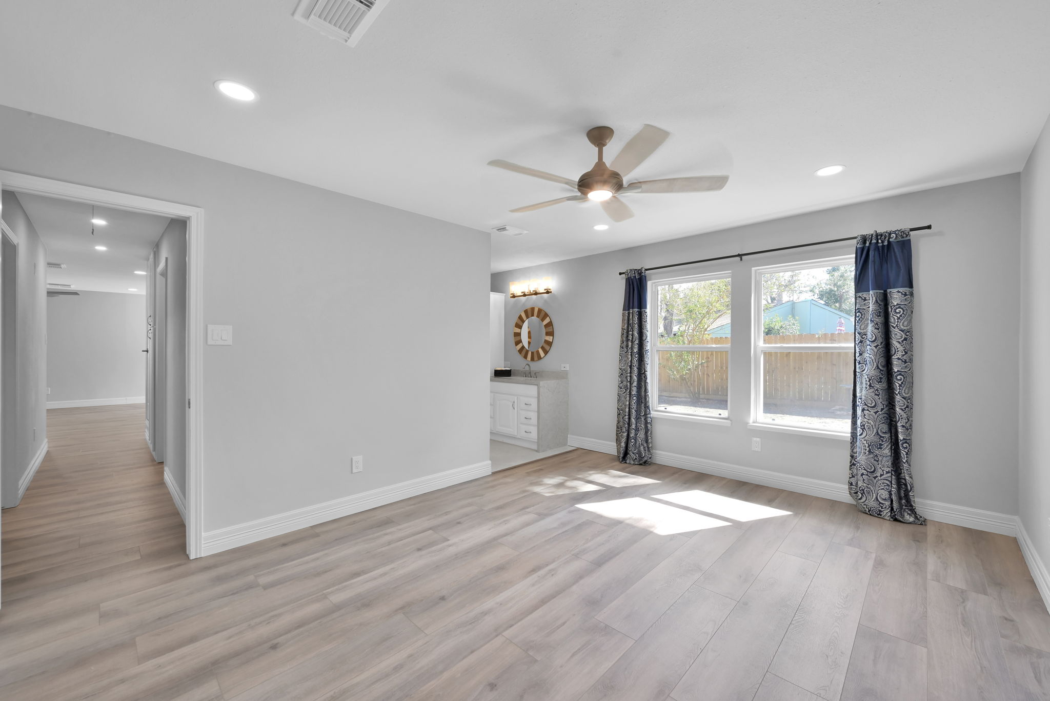 Another view of the PRIMAY BEDROOM. Offers additional recessed lighting & 5 1/2" Baseboards (as seen in all areas in this home).