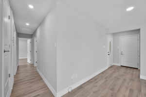 View looking back towards the front door, and down the hallway which leads to the 3 bedrooms.