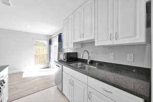 Another view of the kitchen looking back towards the Breakfast area. Comes w/ the microwave & a recently new Samsung Dishwasher.