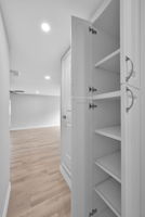 You will LOVE this great "BUILT-IN HALLWAY STORAGE" cabinet (6 different shelves, each 19 1/2" deep).