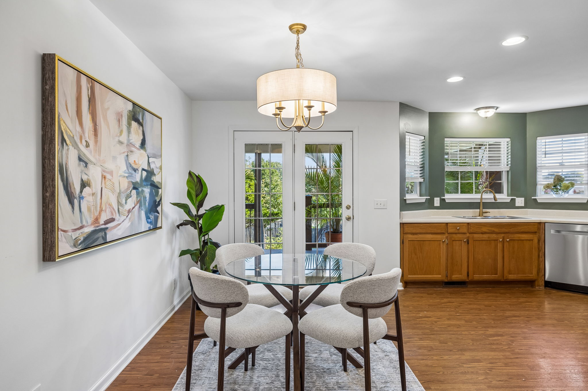View of eat in kitchen, new brushed gold fixtures, all new stainless steel appliances, recessed lights,  double sink, disposal,