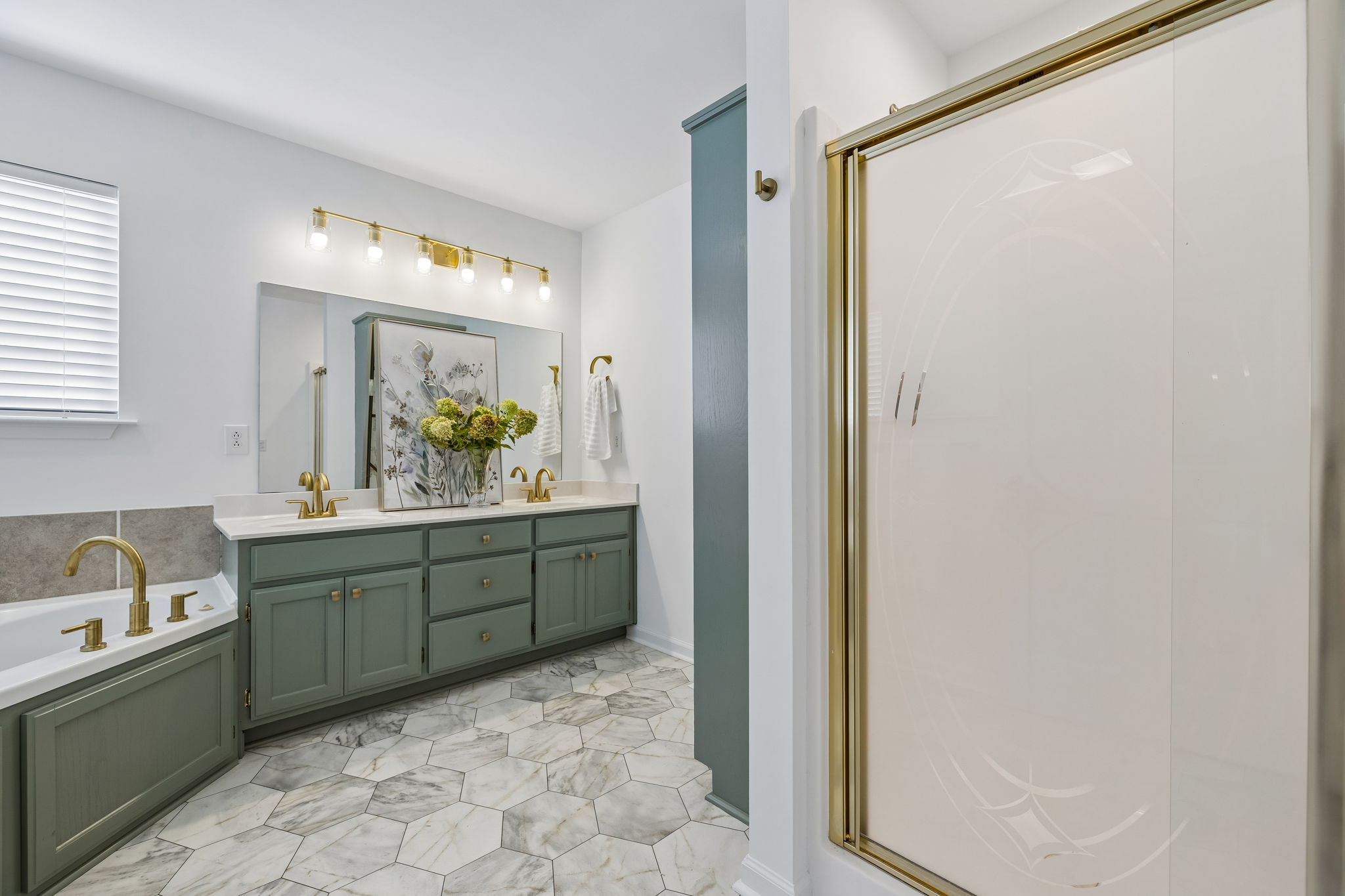 Spacious owner' ensuite with new flooring, separate shower, Jacuzzi tub, double vanities, painted oak cabinets, new brushed gold fixtures, ADA  entry door.