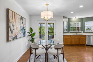 View of eat in kitchen, new brushed gold fixtures, all new stainless steel appliances, recessed lights,  double sink, disposal,