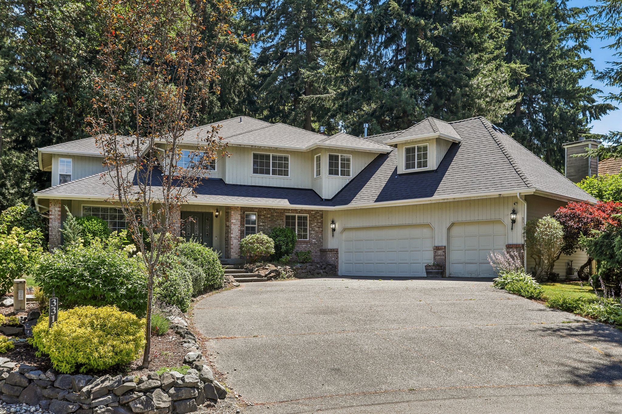 Sits up above the cul-de-sac with space and light. Brand new roof and gutters.