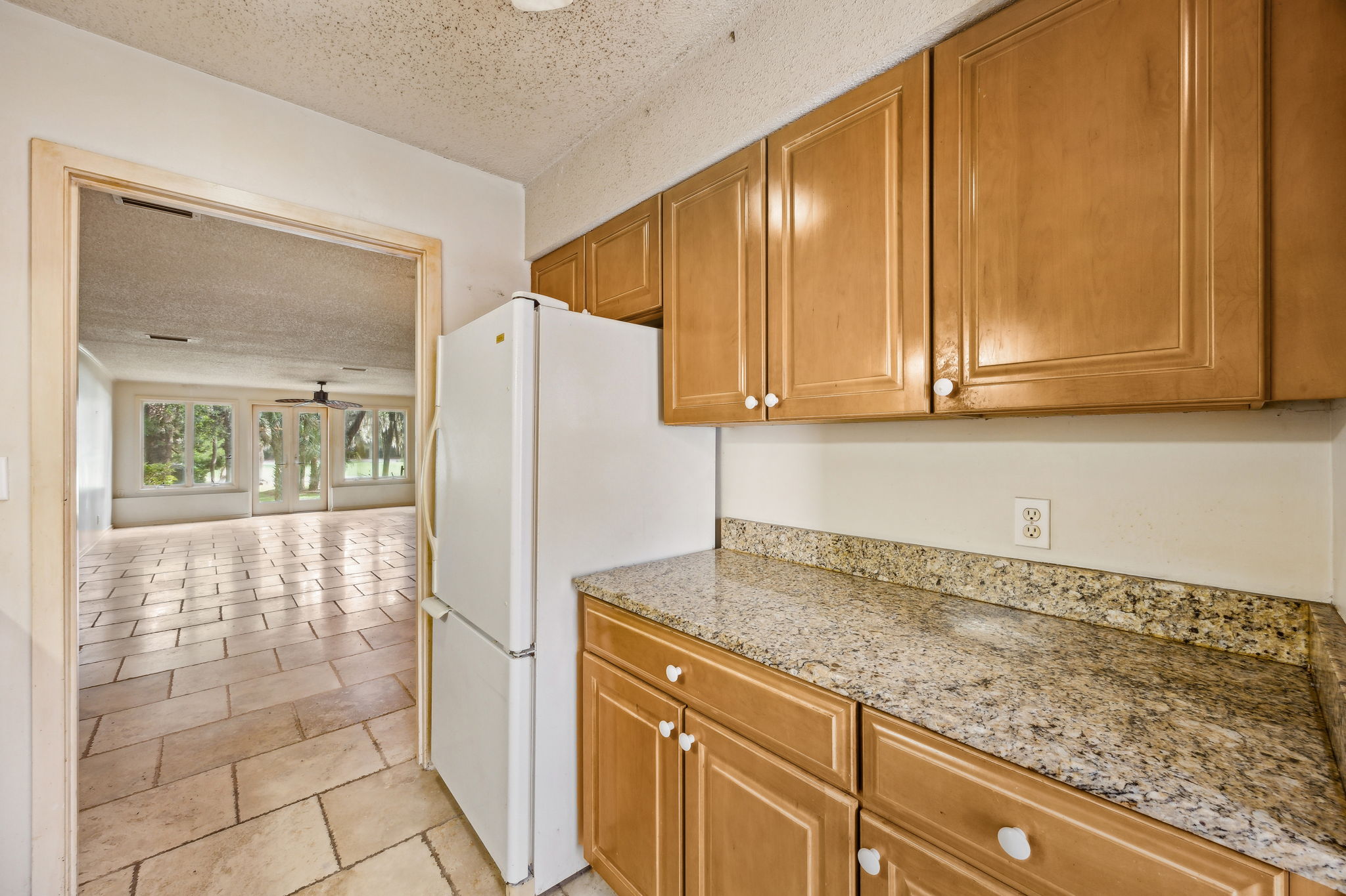 Kitchen to Dining and Living Area.