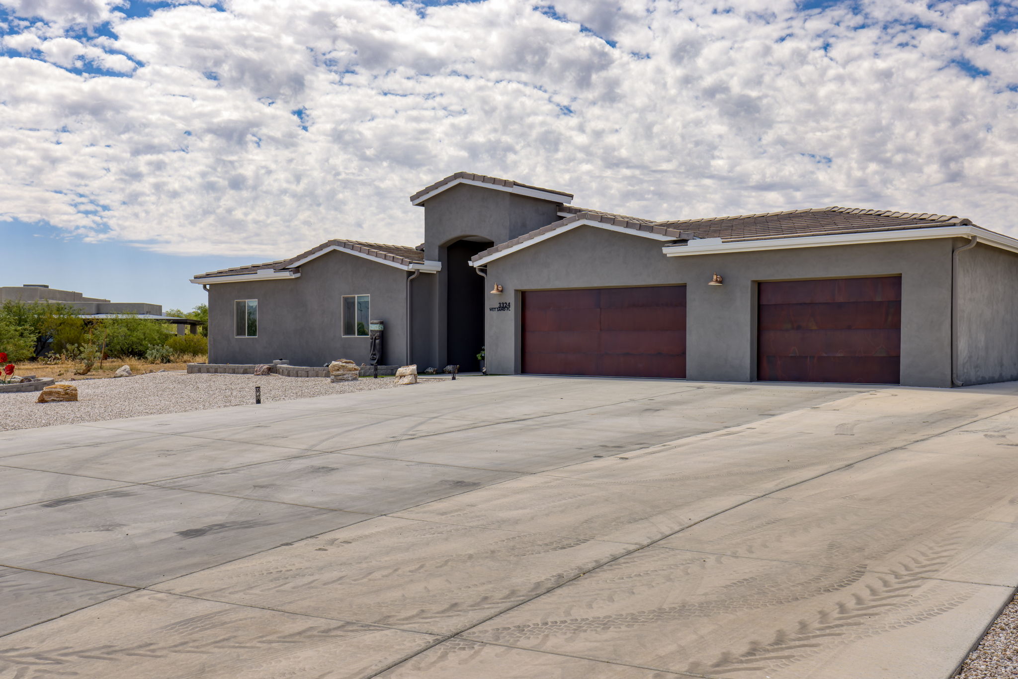 Front Exterior/ Long and extended width concrete driveway